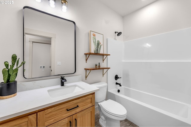 bathroom with toilet, shower / tub combination, and vanity