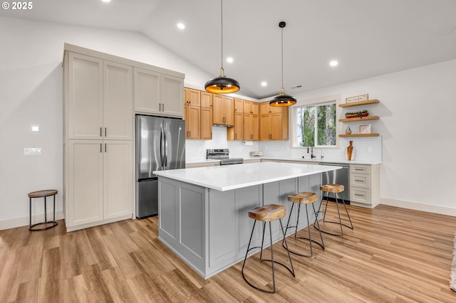 kitchen with light countertops, appliances with stainless steel finishes, a center island, open shelves, and pendant lighting