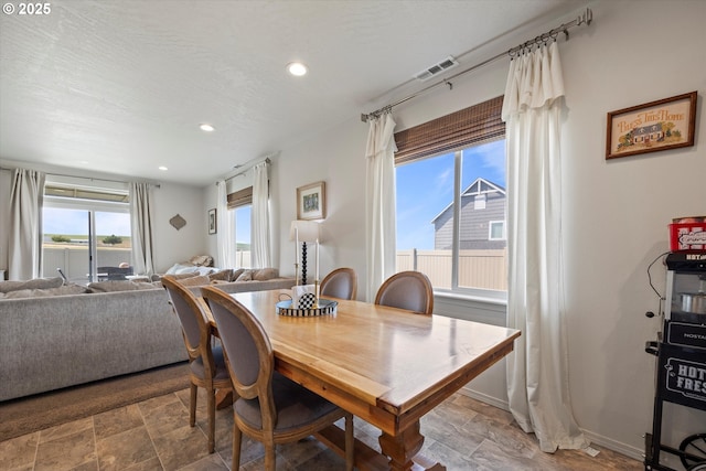 3 Patty Cir, Milton-Freewater, OR 97862 - dining area featuring stone finish floors, recessed lighting, and baseboards