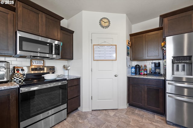 3 Patty Cir, Milton-Freewater, OR 97862 - kitchen featuring appliances with stainless steel finishes, dark brown cabinets, decorative backsplash, and light stone countertops