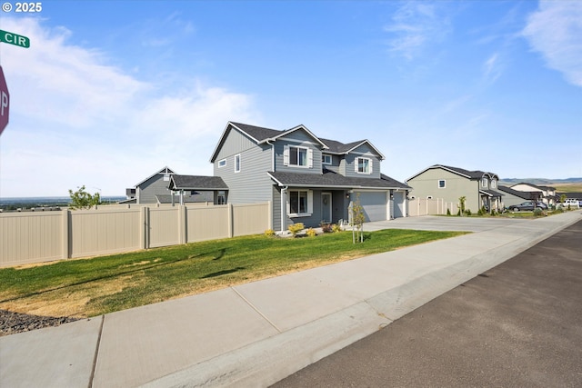 3 Patty Cir, Milton-Freewater, OR 97862 - view of front of house with concrete driveway, a garage, and a residential view