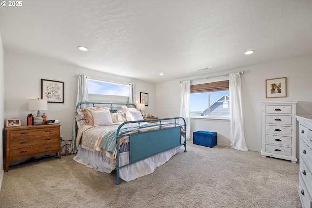 3 Patty Cir, Milton-Freewater, OR 97862 - bedroom featuring light colored carpet, multiple windows, recessed lighting, baseboards, and a textured ceiling