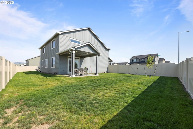 3 Patty Cir, Milton-Freewater, OR 97862 - rear view of property featuring board and batten siding and a patio
