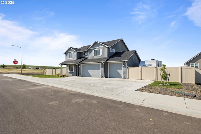 3 Patty Cir, Milton-Freewater, OR 97862 - view of front of home featuring concrete driveway, a garage, a gate, and roof with shingles