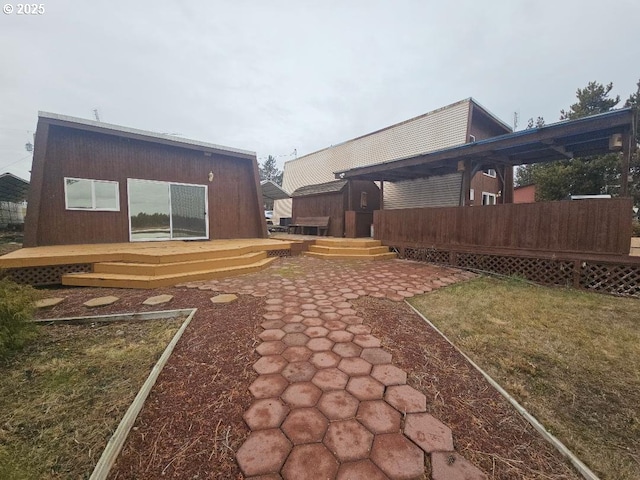 view of yard with a deck and a patio