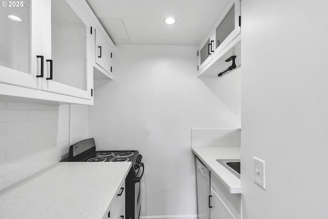 20 NW 16th Ave Unit 4, Portland, OR 97209 - kitchen featuring electric range oven, dishwashing machine, decorative backsplash, white cabinets, and recessed lighting