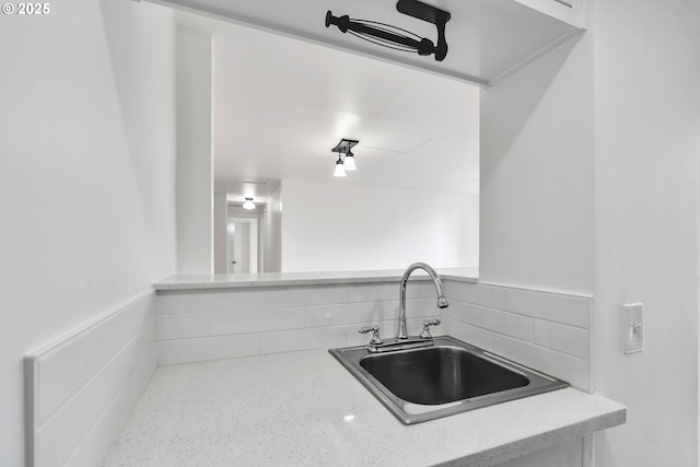20 NW 16th Ave Unit 4, Portland, OR 97209 - kitchen featuring a sink, tasteful backsplash, and light stone countertops