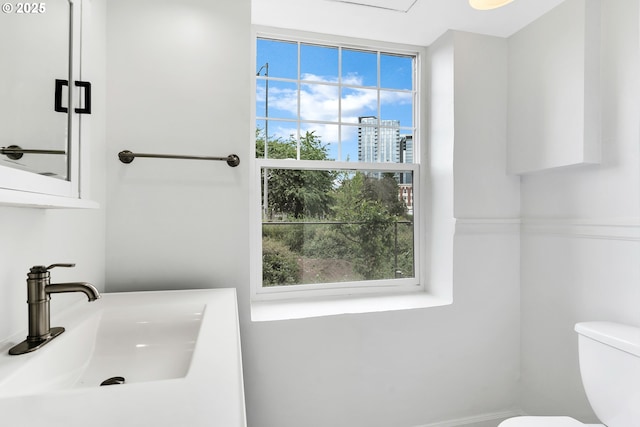 20 NW 16th Ave Unit 4, Portland, OR 97209 - bathroom with a sink, toilet, and healthy amount of natural light