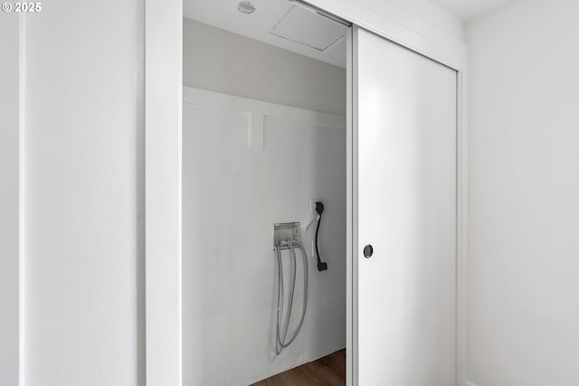 20 NW 16th Ave Unit 4, Portland, OR 97209 - washroom with electric dryer hookup, hookup for a washing machine, and dark wood-style flooring