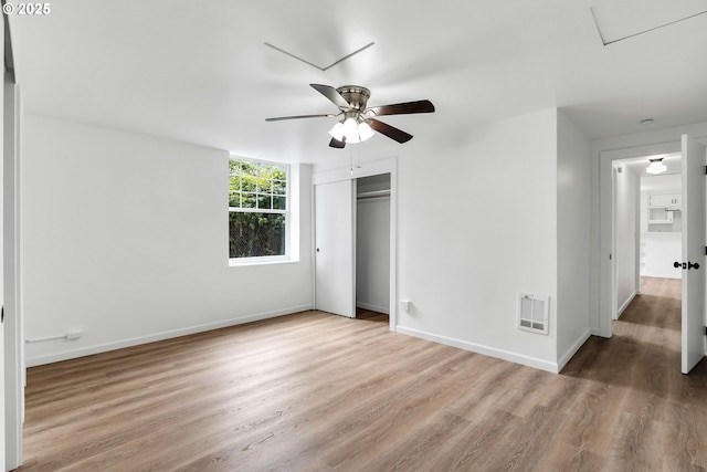 20 NW 16th Ave Unit 4, Portland, OR 97209 - unfurnished bedroom featuring wood finished floors, a closet, baseboards, and ceiling fan