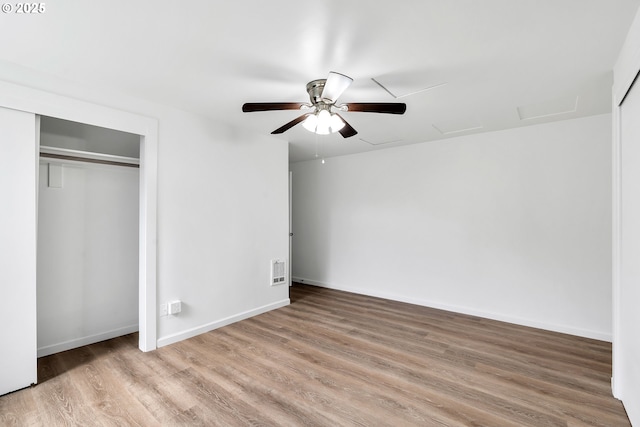 20 NW 16th Ave Unit 4, Portland, OR 97209 - unfurnished bedroom featuring attic access, wood finished floors, baseboards, and ceiling fan