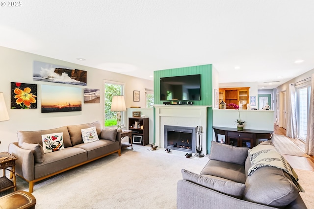 7605 SW Arbor Glen Ct, Wilsonville, OR 97070 - carpeted living area with a fireplace with flush hearth and recessed lighting