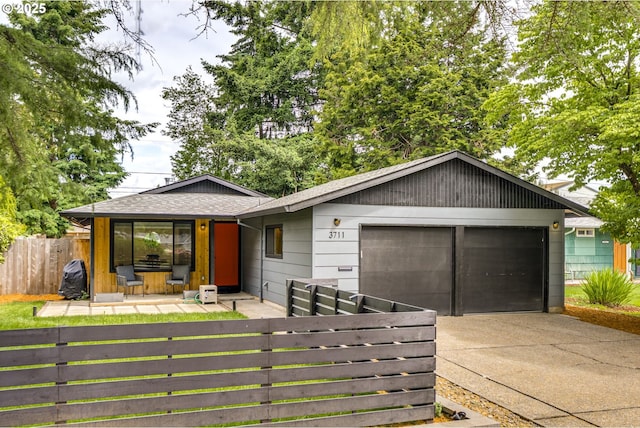 3711 N Alaska Pl, Portland, OR 97217 - single story home featuring a garage, driveway, a shingled roof, and a porch