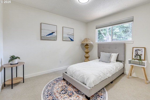 3711 N Alaska Pl, Portland, OR 97217 - bedroom featuring carpet floors, baseboards, and a textured ceiling