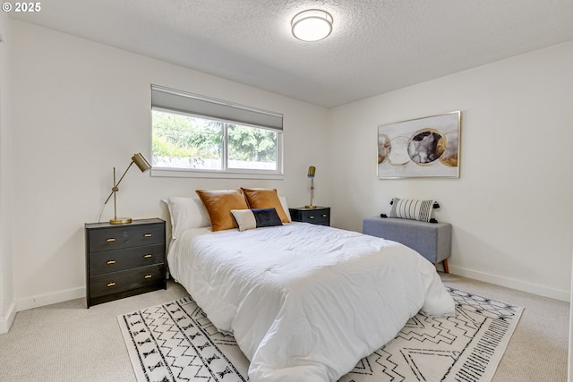 3711 N Alaska Pl, Portland, OR 97217 - bedroom featuring light colored carpet, a textured ceiling, and baseboards