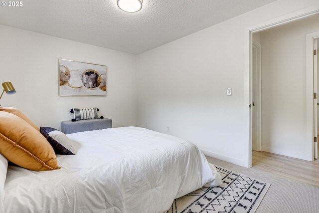 3711 N Alaska Pl, Portland, OR 97217 - bedroom with a textured ceiling, light carpet, and baseboards