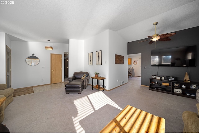 living room with ceiling fan, light colored carpet, lofted ceiling, and a textured ceiling