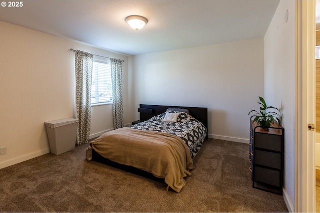 bedroom featuring carpet and baseboards