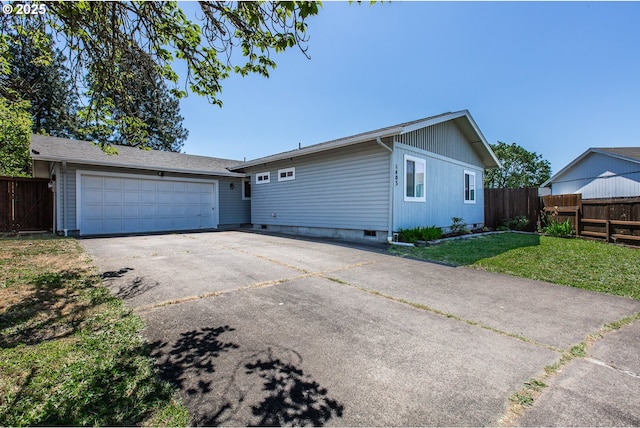 ranch-style home with a garage