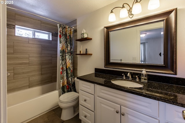 bathroom featuring toilet, vanity, shower / bath combo, and a textured ceiling