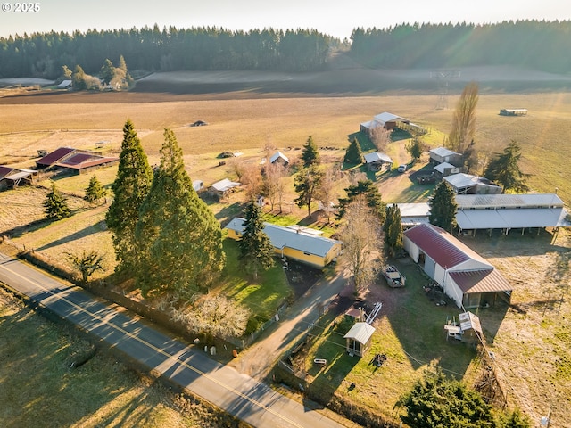 birds eye view of property with a rural view