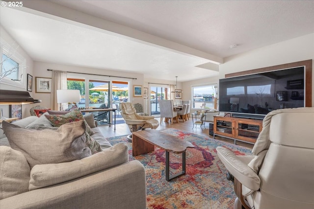 460 N Tomahawk Island Dr, Portland, OR 97217 - living area with beamed ceiling and wood finished floors