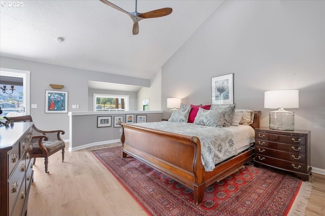 460 N Tomahawk Island Dr, Portland, OR 97217 - bedroom with light wood finished floors, high vaulted ceiling, and a ceiling fan