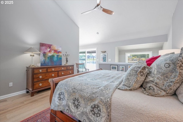 460 N Tomahawk Island Dr, Portland, OR 97217 - bedroom with lofted ceiling, access to exterior, wood finished floors, and a ceiling fan
