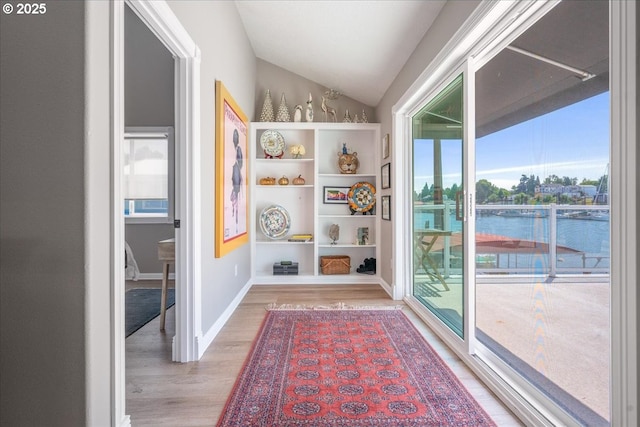460 N Tomahawk Island Dr, Portland, OR 97217 - corridor with light wood-style floors and vaulted ceiling