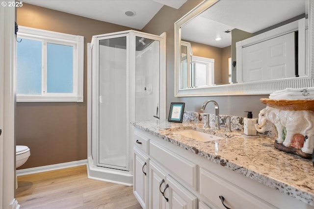 460 N Tomahawk Island Dr, Portland, OR 97217 - full bath featuring wood finished floors, a stall shower, and vanity