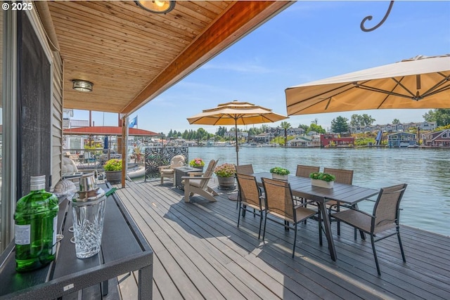 460 N Tomahawk Island Dr, Portland, OR 97217 - wooden deck featuring a water view and outdoor dining area
