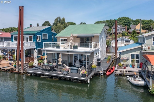 460 N Tomahawk Island Dr, Portland, OR 97217 - back of property with a water view and a balcony