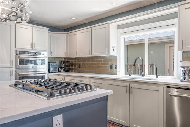 460 N Tomahawk Island Dr, Portland, OR 97217 - kitchen with appliances with stainless steel finishes, decorative backsplash, white cabinetry, and recessed lighting