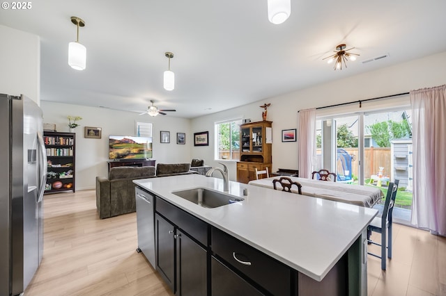 15506 NE 72nd Way, Vancouver, WA 98682 - kitchen featuring appliances with stainless steel finishes, a sink, open floor plan, a ceiling fan, and pendant lighting