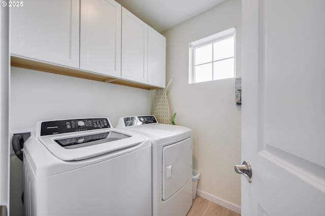 15506 NE 72nd Way, Vancouver, WA 98682 - clothes washing area with cabinet space, washing machine and clothes dryer, light wood-style flooring, and baseboards