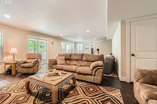 living area with dark wood-style floors, recessed lighting, and baseboards