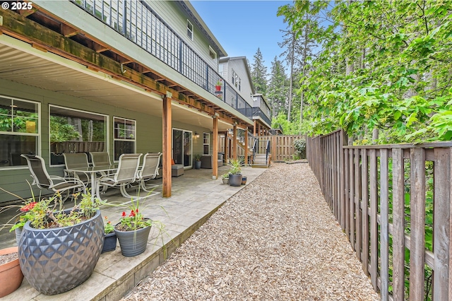 fenced backyard with a patio area