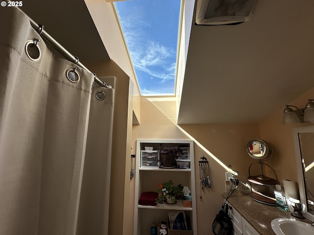 full bath with curtained shower and vanity