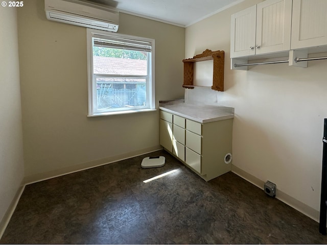 washroom with a wall mounted AC, baseboards, and ornamental molding