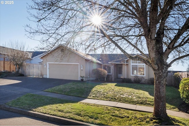 ranch-style home featuring a garage and a front yard