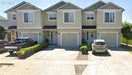 Catron St, Monmouth, OR 97361 - view of front facade with concrete driveway and a garage