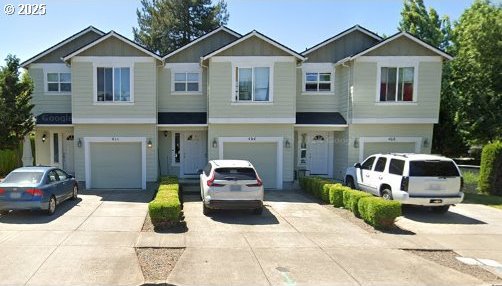 Catron St, Monmouth, OR 97361 - view of front facade with driveway and an attached garage