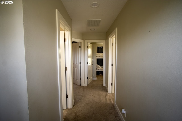 1072 53rd St, Springfield, OR 97478 - hall with visible vents, baseboards, and carpet flooring