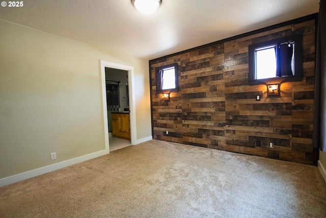 1072 53rd St, Springfield, OR 97478 - spare room with carpet floors, wood walls, healthy amount of natural light, and baseboards