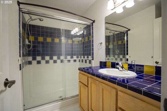 1072 53rd St, Springfield, OR 97478 - full bathroom featuring a stall shower, vanity, and tile patterned floors