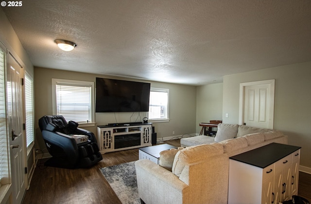 1072 53rd St, Springfield, OR 97478 - living area featuring a textured ceiling, baseboards, and dark wood finished floors