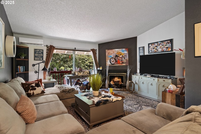 living area with a textured ceiling, a warm lit fireplace, and a wall mounted AC