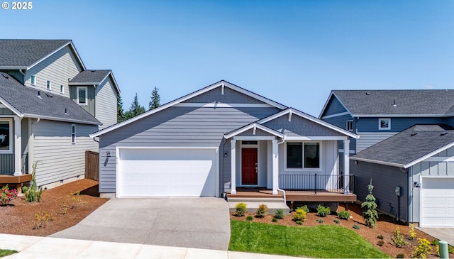 819 Misty Ln, Forest Grove, OR 97116 - view of front of house with driveway, an attached garage, covered porch, and board and batten siding