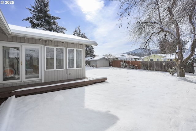 view of yard layered in snow