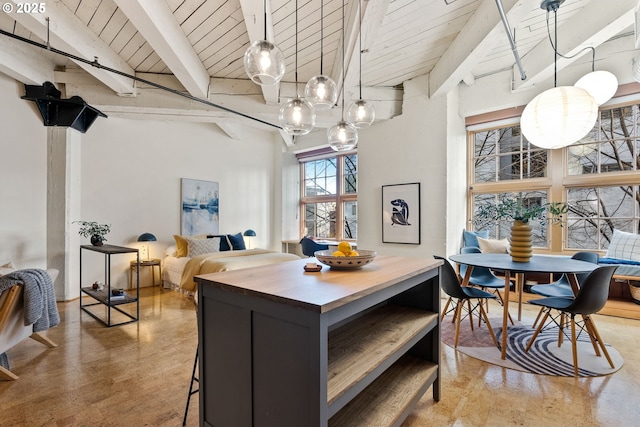 dining area featuring wooden ceiling and beamed ceiling